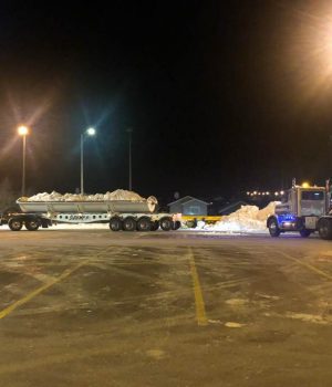 trucks hauling snow